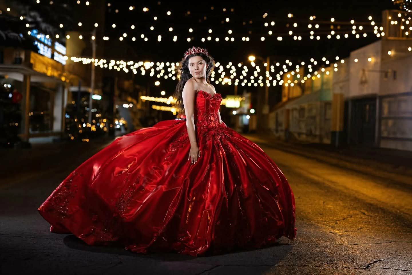 Red beaded quinceañera ballgown with tiara on Main Street